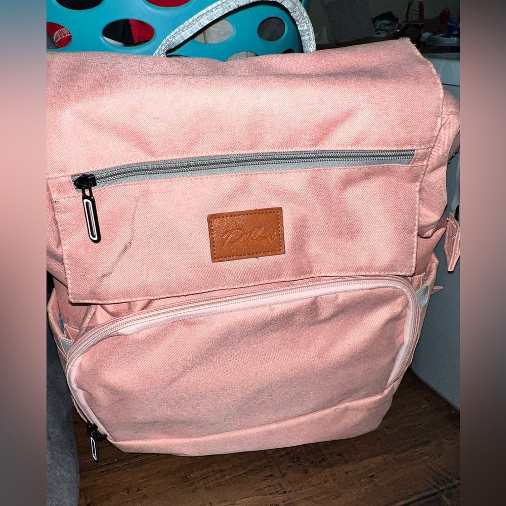 Pink diaper bag change table
